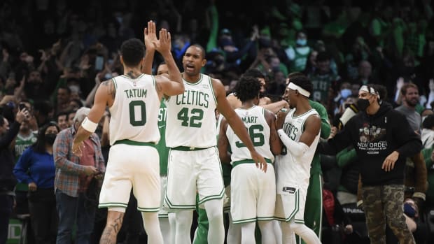 Dec 1, 2021; Boston, Massachusetts, USA; Boston Celtics forward Jayson Tatum (0) high fives center Al Horford (42) after defeating the Philadelphia 76ers at TD Garden. Mandatory Credit: Bob DeChiara-USA TODAY Sports